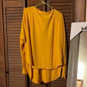 3x mustard sweater with cris cross in the back.